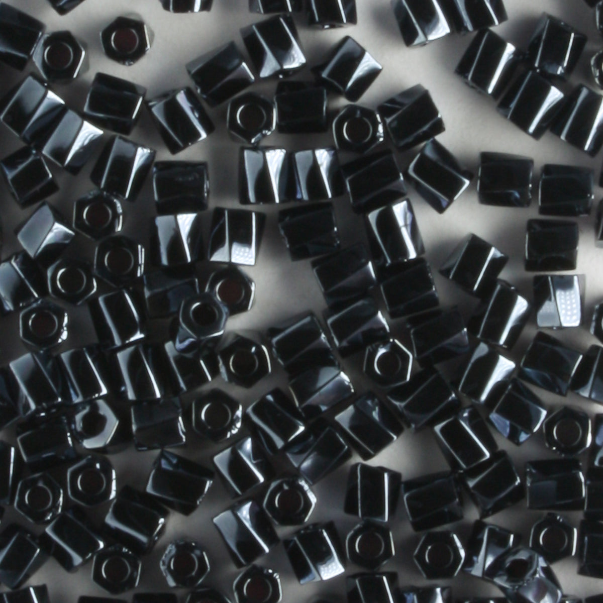 10/0 Hex Cut with a Twist Hematite - 10 grams